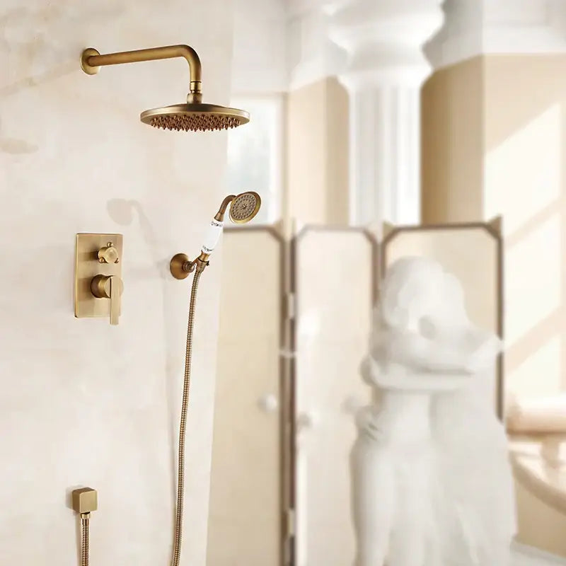 Brass-finished shower mixer set with 8 inch circular textured rainfall shower head and matching handheld attachment
