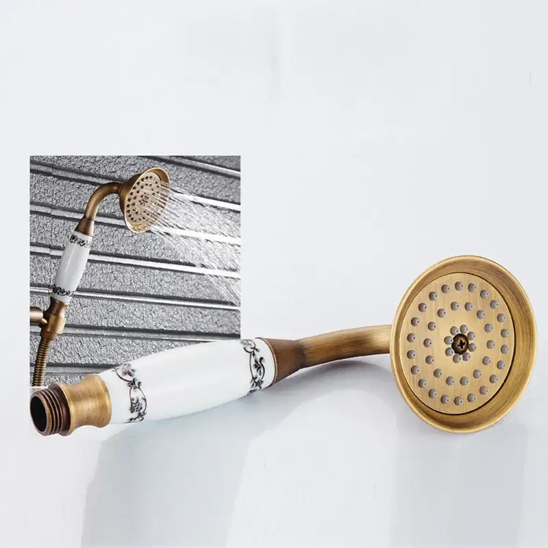 DecorBites™ antique brass shower mixer set with white ceramic handshower and ornate black floral detailing on handle