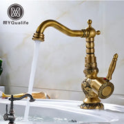 Decorbites antique brass bathroom sink faucet mixer with ornate vintage detailing and curved spout in brass bathroom sink