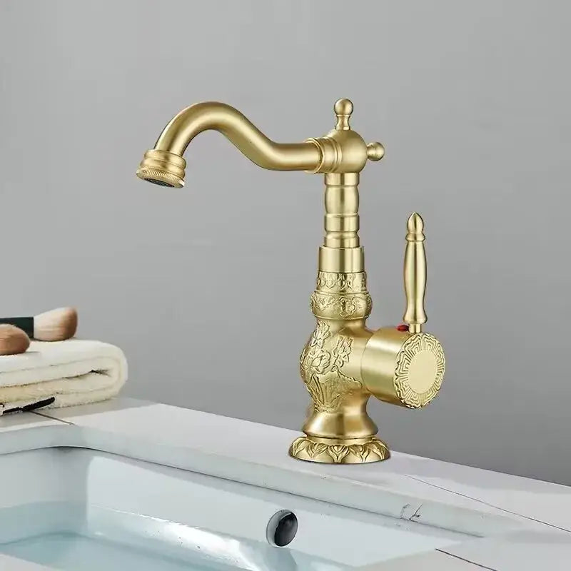DecorBites antique brass bathroom sink faucet mixer with ornate floral engravings and classic curved spout in brass bathroom sink design