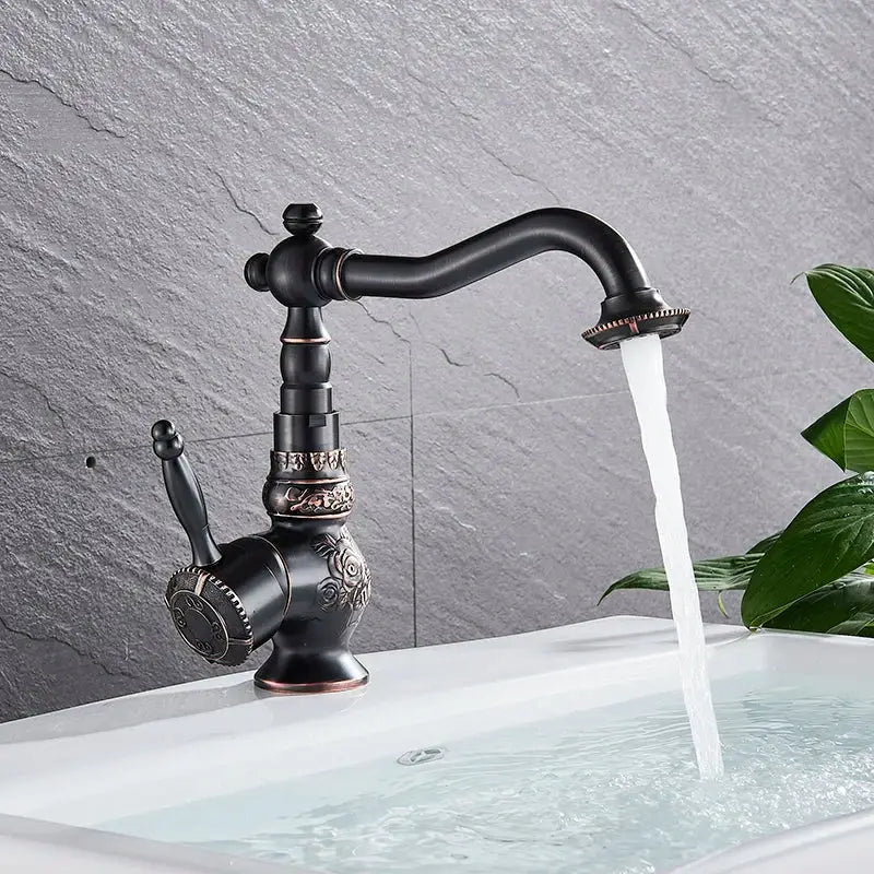 Decorbites antique brass bathroom sink faucet mixer with single handle and ornate floral detailing in antique brass finish