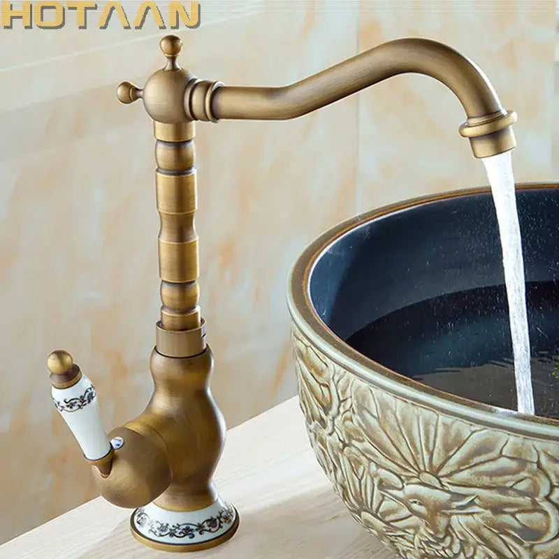 Decorbites antique brass bathroom sink faucet single handle deck mounted basin mixer with ornate segmented spout and ceramic base