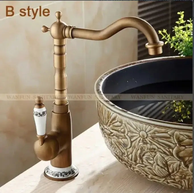 Decorbites antique brass bathroom sink faucet with white ceramic handle and black floral detailing single handle mixer