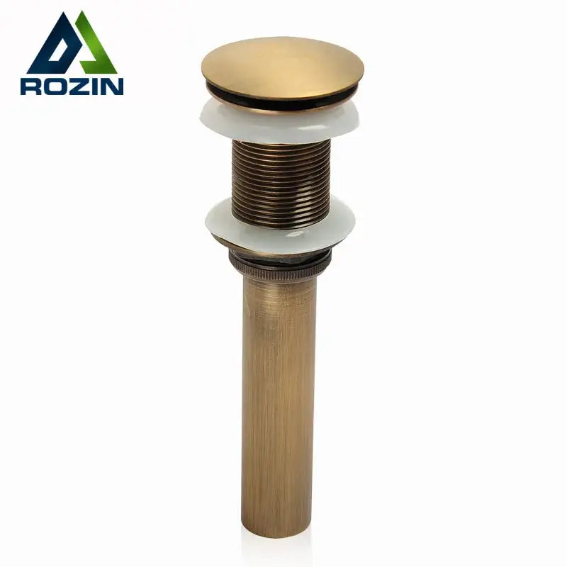 DecorBites antique brass bathroom sink pop up drain with sleek cylindrical body and white ceramic washers for vessel sink