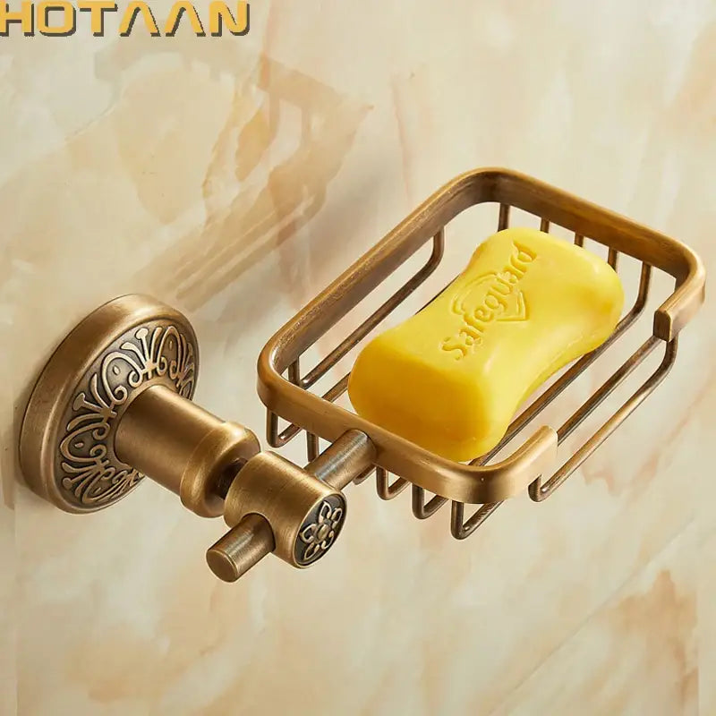 Decorbites™ antique brass soap dish holder with ornate scrollwork and yellow safeguard soap in a wall mounted soap basket