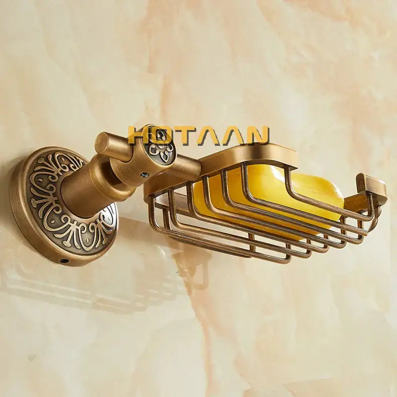 DecorBites™ antique brass wall-mounted soap dish holder with ornate scrollwork design and a yellow soap basket