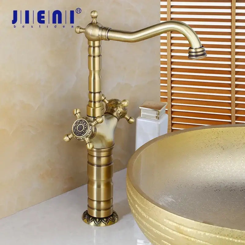 DecorBites™ antique brass carved single-handle bathroom faucet with ornate fluted spout and detailed control knobs