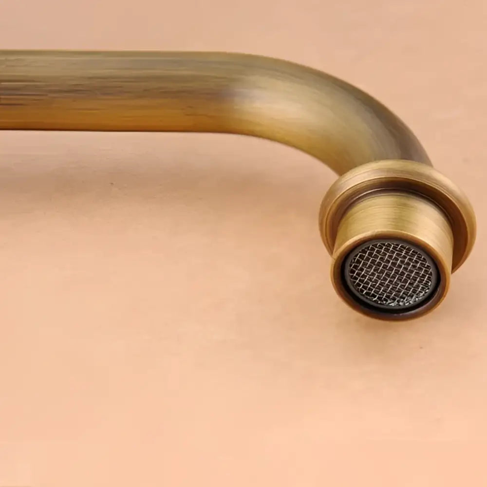 Decorbites antique brass double cross handle basin faucet with curved spout and mesh screen nozzle
