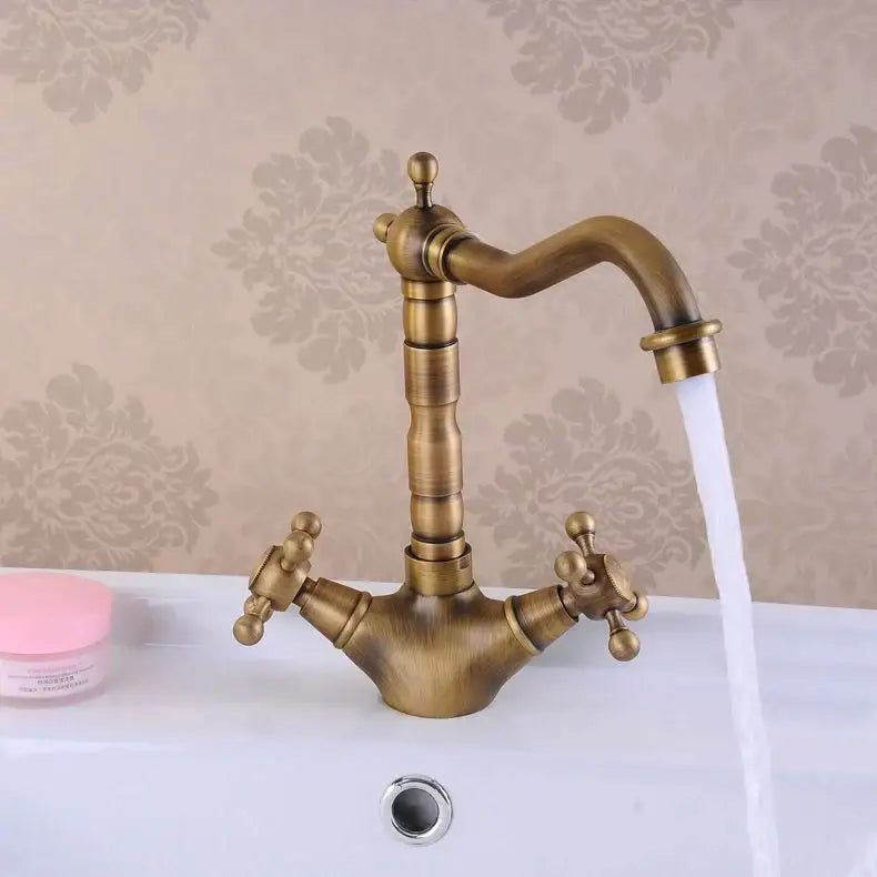 Decorbites antique brass double cross handle basin faucet with curved spout and 360 degree swivel design