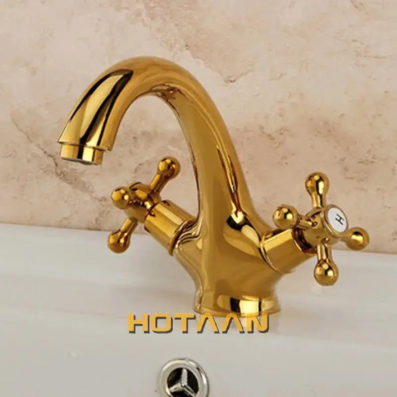 Gold-colored polished brass DecorBites™ antique brass double handle basin mixer tap with cross-shaped handles and curved spout