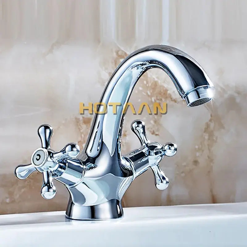 Chrome-finished classic-style basin mixer tap with two cross handles and curved spout for kitchen and bathroom use