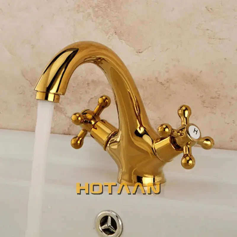 Gold-colored polished brass DecorBites™ antique brass double handle basin mixer tap with cross handles for kitchen and bathroom