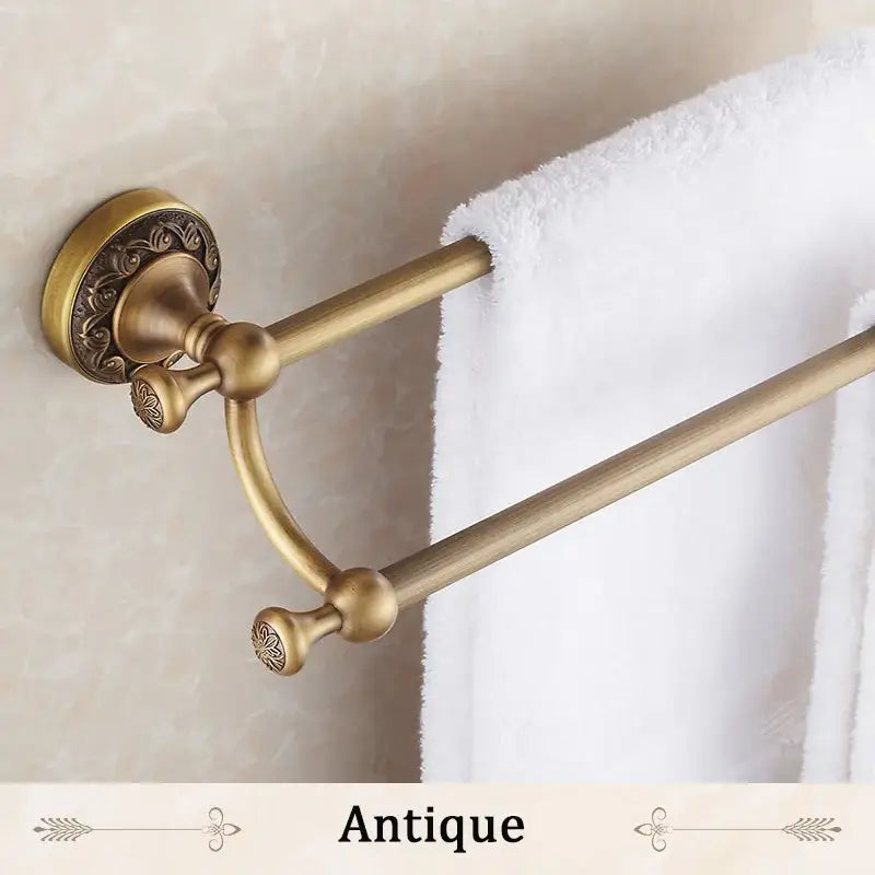 DecorBites™ antique brass double towel bar with ornate detailing and vintage finish for bathroom use