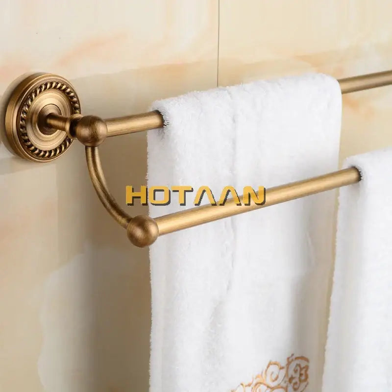 DecorBites antique brass double towel bar rack made of solid brass with ornate circular wall mount and spherical connectors