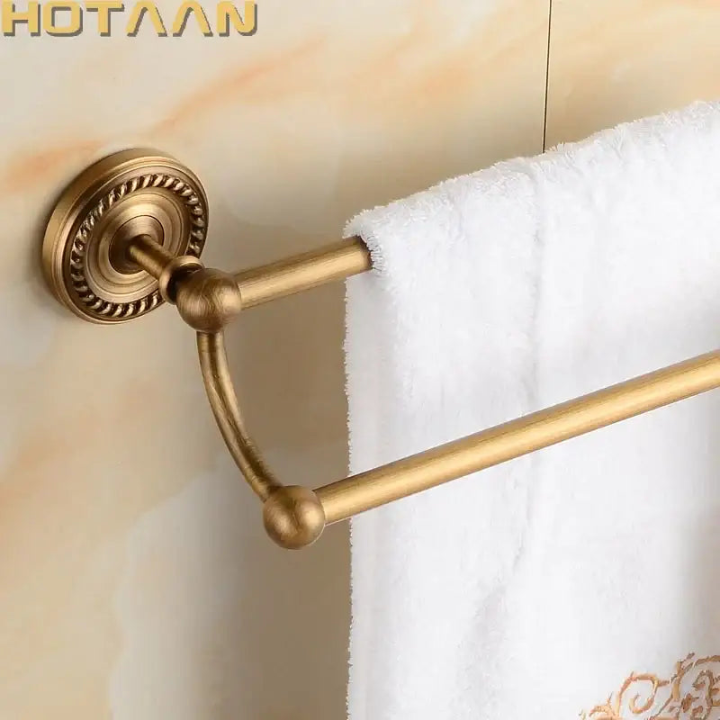 DecorBites™ antique brass double towel bar rack with ornate circular mounts and polished solid brass bars