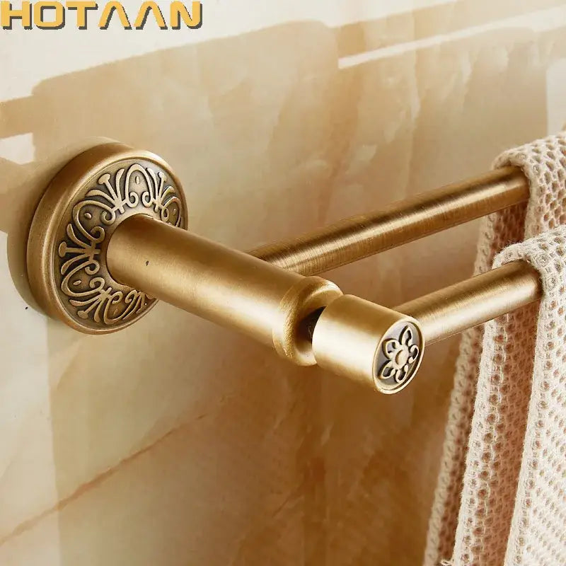 DecorBites antique brass double towel bar made of solid aluminium with ornate floral detailing on circular bases and end caps