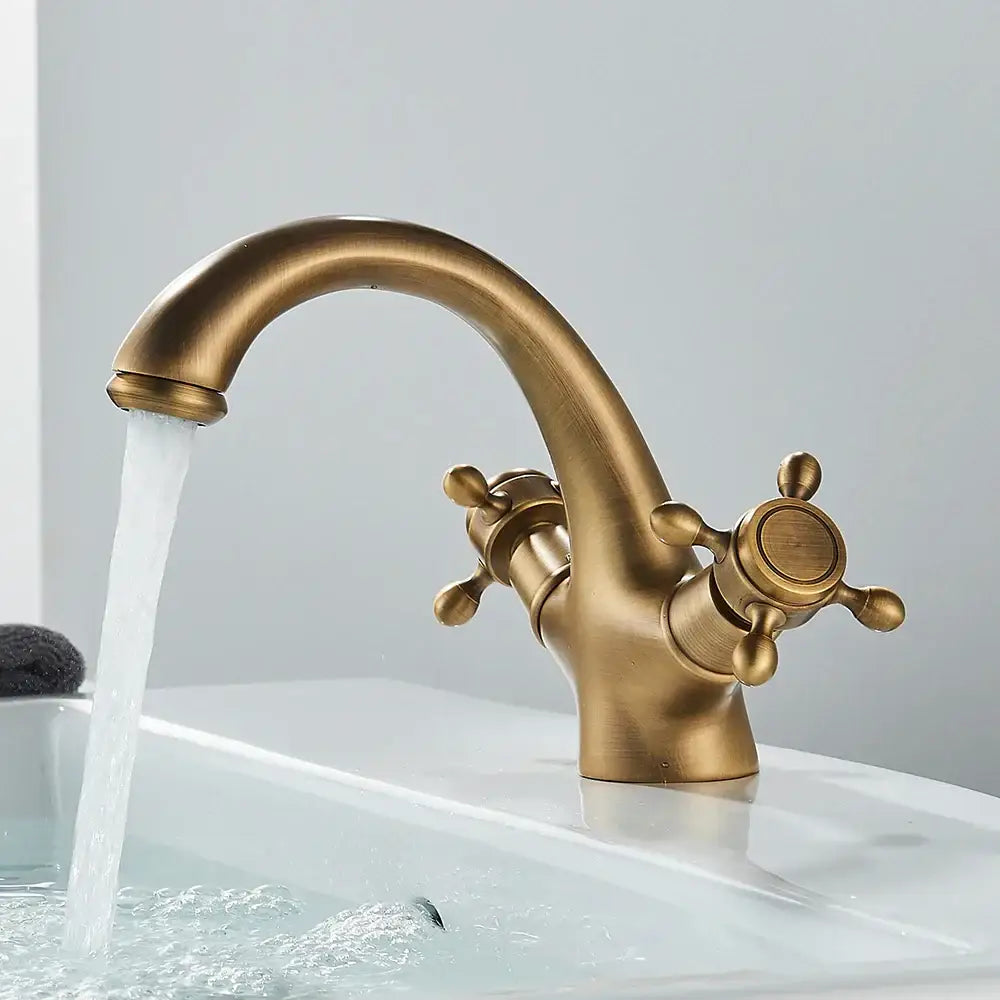 Decorbites antique brass dual handle basin faucet with curved spout and cross handles for bathroom deck mounting