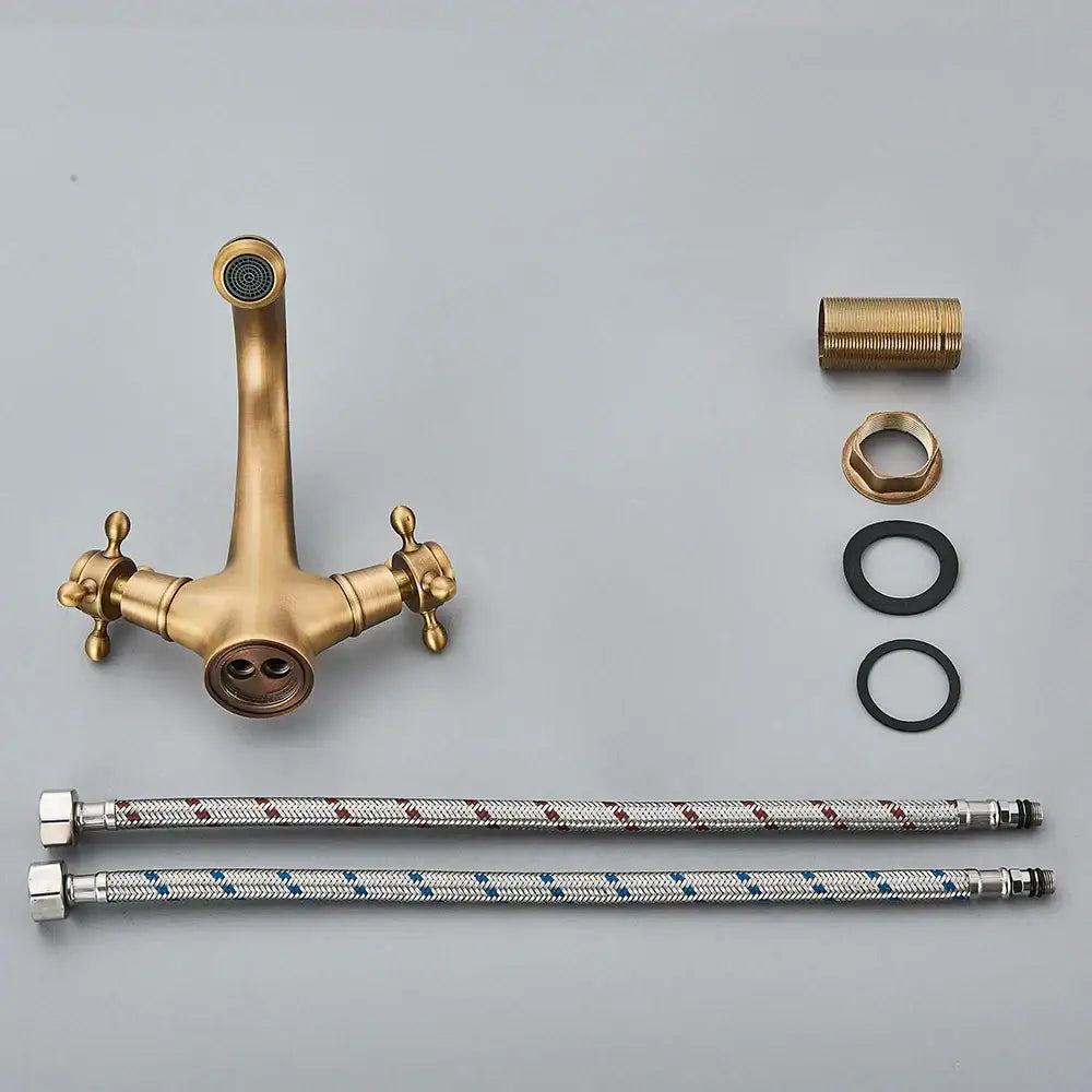 DecorBites™ antique brass dual handle basin faucet with decorative cross handles and curved spout deck mounted mixer tap