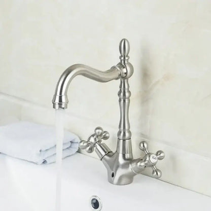 Stylish brushed stainless steel kitchen faucet with elegant curved spout and antique brass dual handle knobs