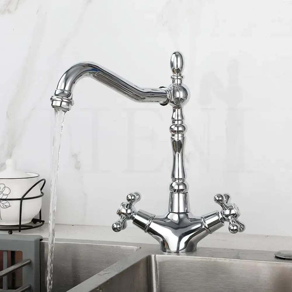 Chrome-finished vintage dual handle kitchen faucet with ornate detailing and cross-shaped handles for antique brass dual use