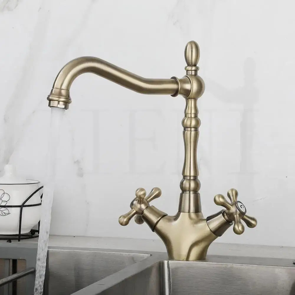 DecorBites™ antique brass dual handle farmhouse kitchen faucet with ornate cross handles and curved swivel spout