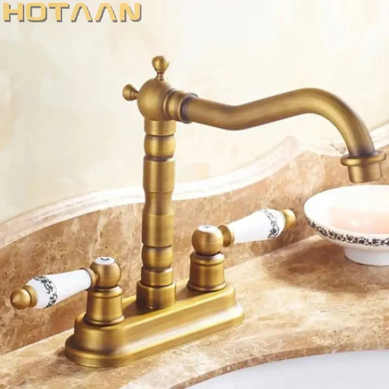 Decorbites™ antique brass dual hole basin faucet mixer tap with ornate segmented spout and ceramic handles