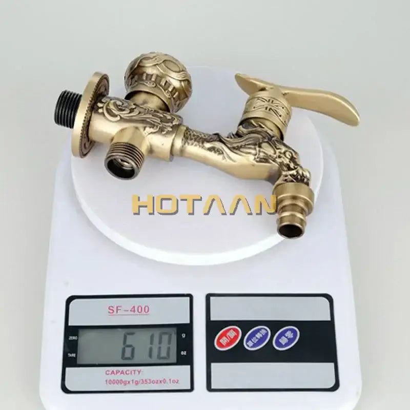 Decorbites™ antique brass finish garden bibcock faucet wall mount with ornate dragon embossing and dual-handle design