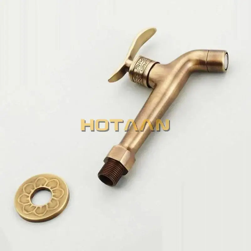 DecorBites™ antique brass finish wall mount bibcock faucet with ornate floral engraving and matching decorative cap