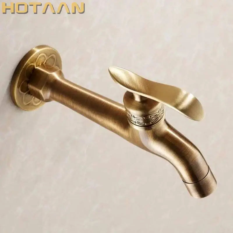 DecorBites™ antique brass finish wall mount bibcock faucet with ornate floral detailing for bathroom and washing machine use