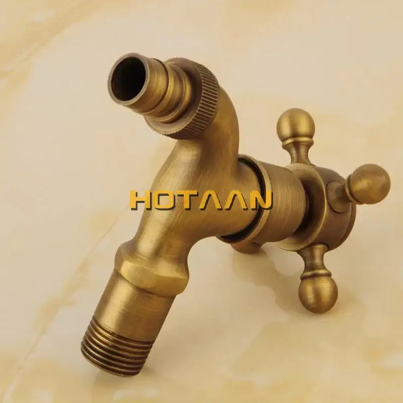 DecorBites™ antique brass finish wall mount garden bibcock faucet with cross-handle design in brass finish
