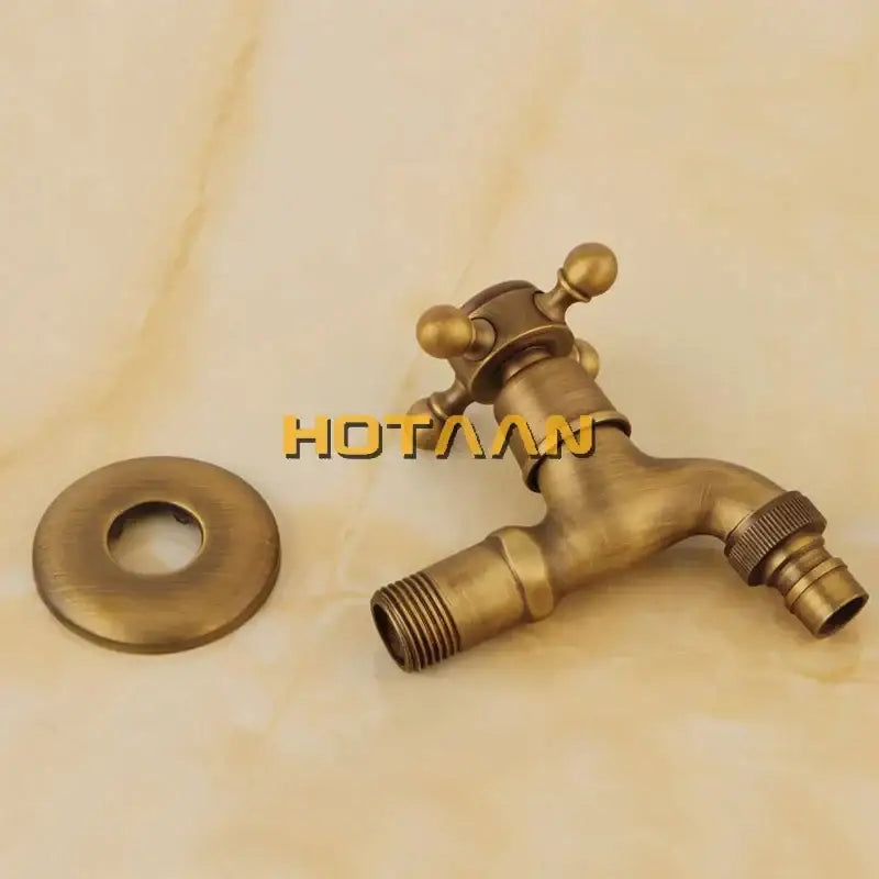 DecorBites™ antique brass finish wall mount garden bibcock faucet with ornate cross handle and threaded connections