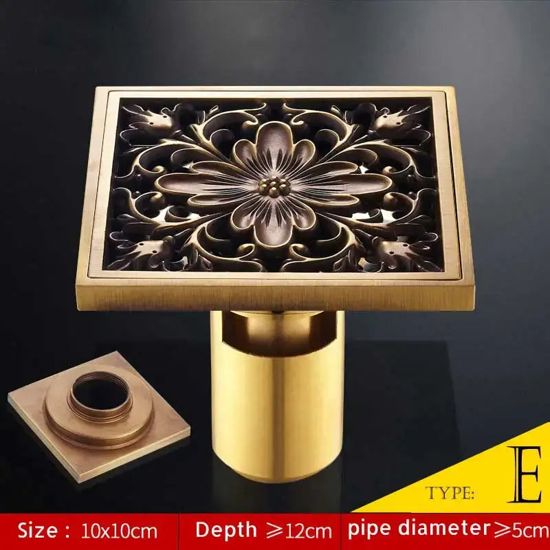 Brass square shower drain cover with intricate floral engraving in antique brass fish style for floor drainer use