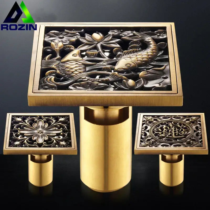 Brass-finished square shower drain with antique brass fish design featuring lotus flowers for floor use