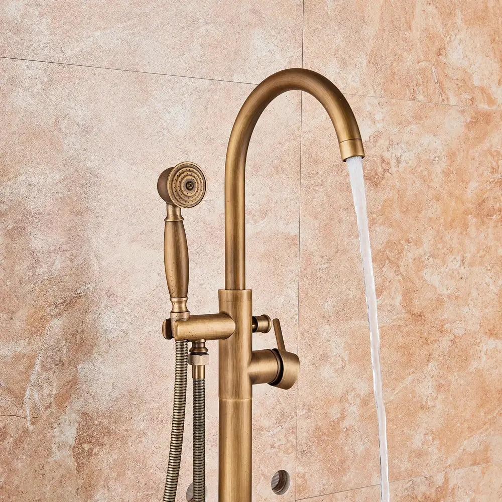 Brass-finished freestanding antique brass floor mount tub faucet with swivel spout mixer tap and handheld showerhead