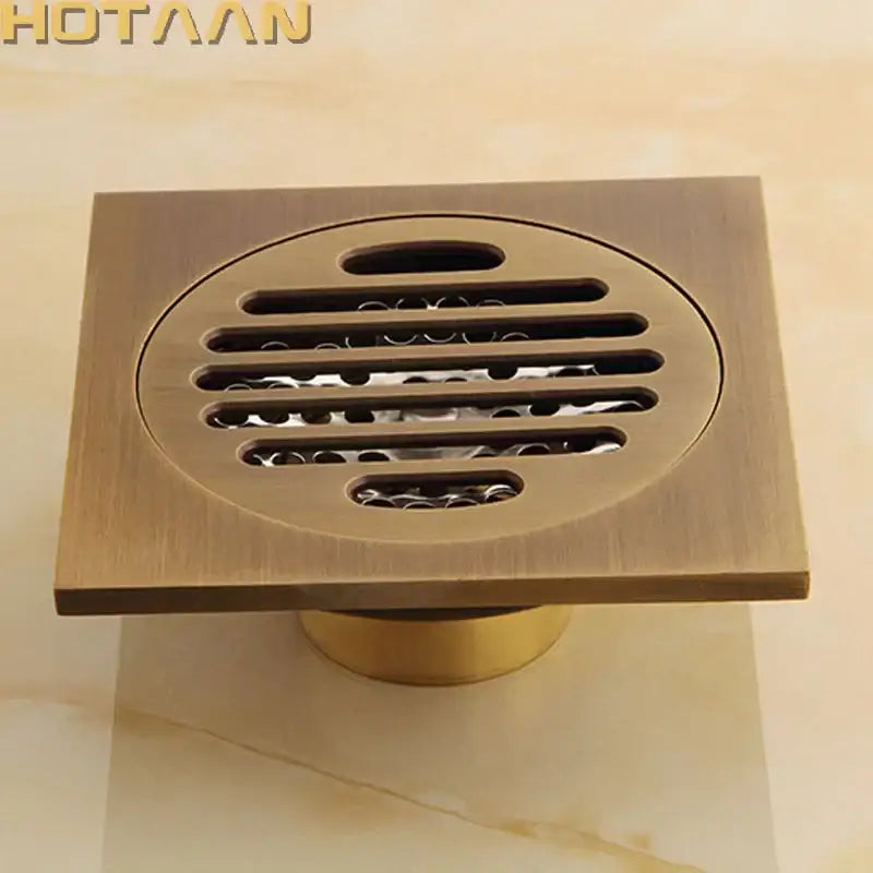 DecorBites antique brass flower art floor drain with square brass finish and circular grille for bathroom use