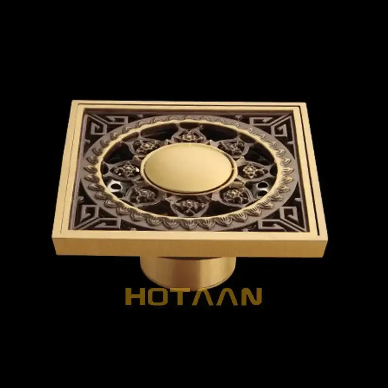 DecorBites™ antique brass floor drain with flower art and geometric patterns in gold color for bathroom use