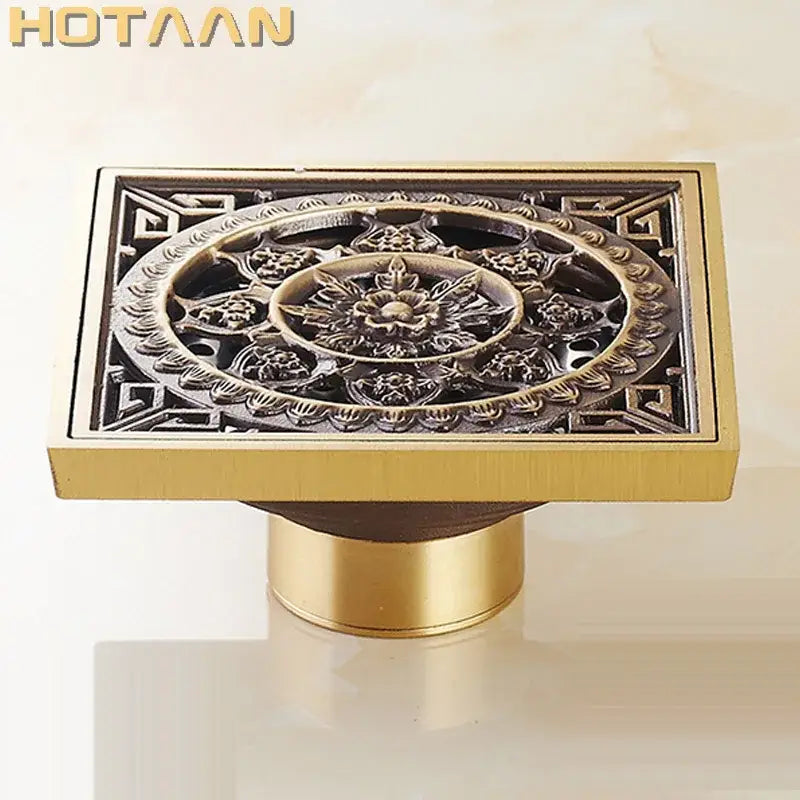 Decorbites™ antique brass floor drain with intricate flower art embossing in brass finish for bathroom use