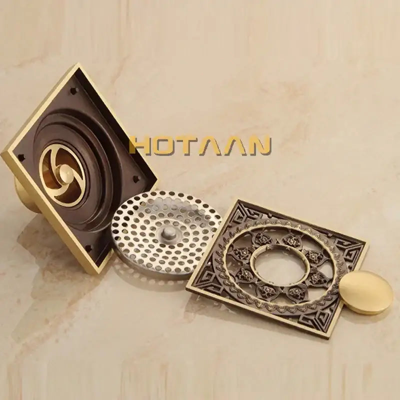 Decorbites™ antique brass flower art floor drain with ornate floral and geometric detailing in dark bronze and brass