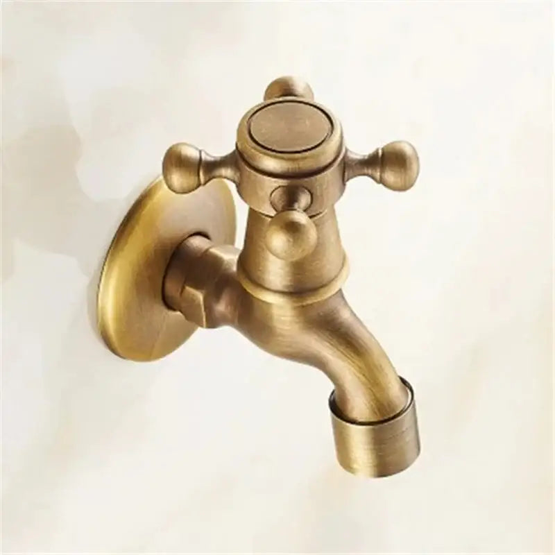 Antique brass garden bibcock tap with cross-handle design for decorative bathroom and outdoor use by DecorBites™