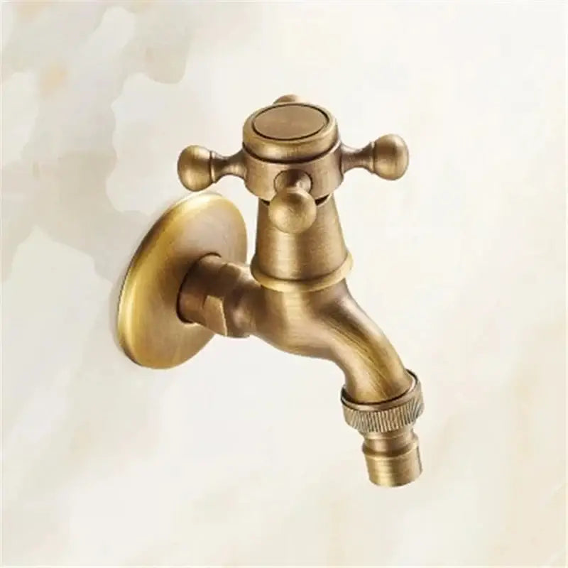 Antique brass garden bibcock tap with cross-shaped handle and textured spout for bathroom and outdoor use