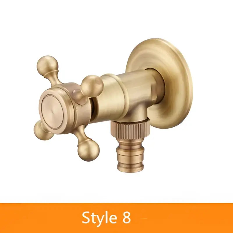 Brass-finished antique brass garden bibcock with cross handle and threaded hose connection for outdoor use