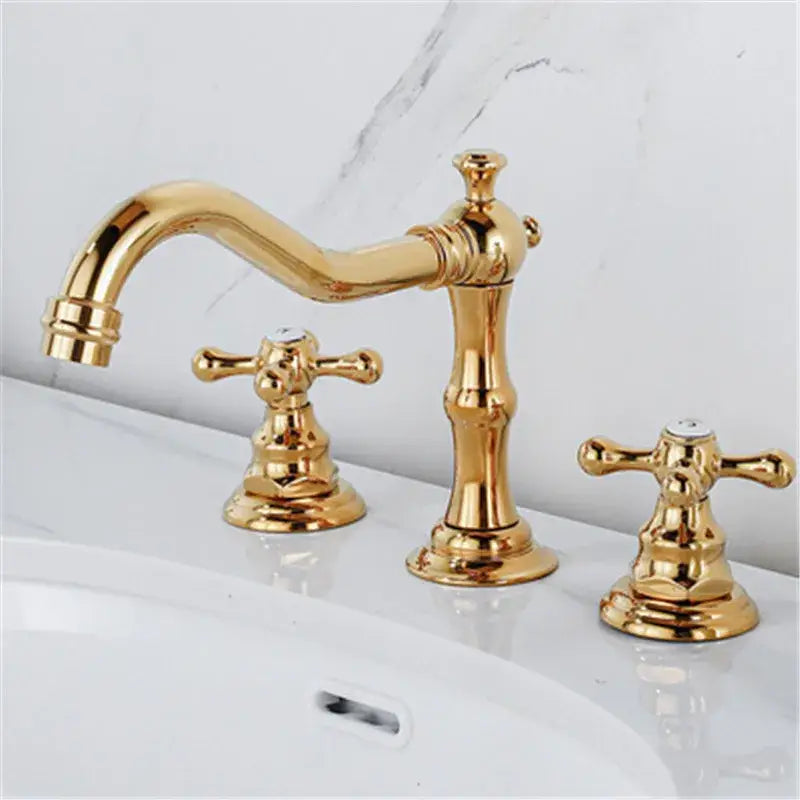Decorbites antique brass gold bathroom basin faucet with three brass gold handles and ornate cross-shaped design