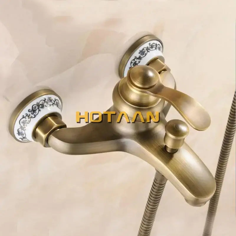 Decorbites antique brass shower head kit with ornate white ceramic handles featuring black floral patterns for bathtub