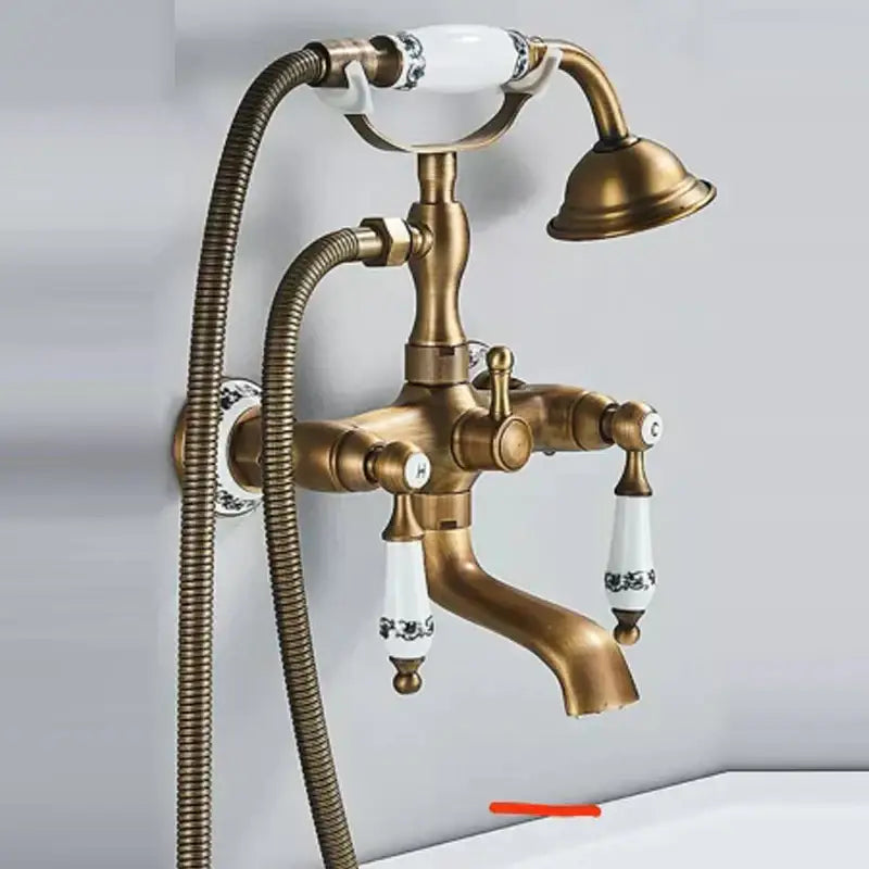 DecorBites™ antique brass shower head kit with white ceramic handles featuring black floral patterns and matching showerhead