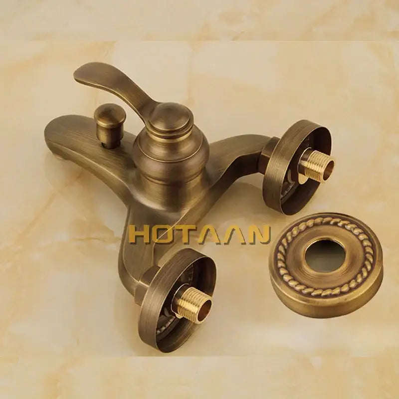 Antique brass-finished bathtub faucet with ornate vintage design and decorative escutcheon in decorbites shower head kit