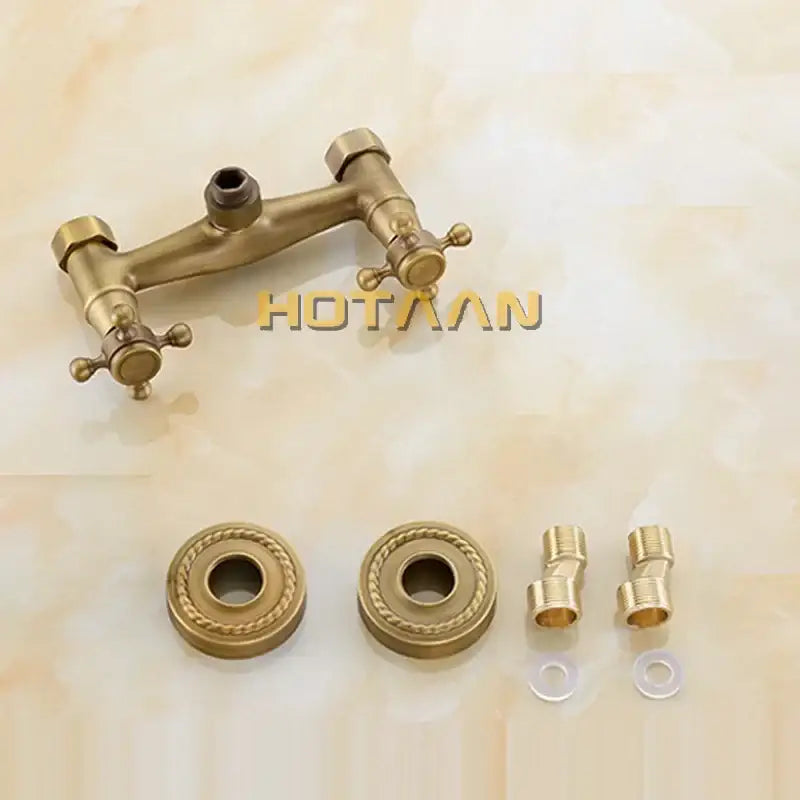 Antique brass hand held shower kit featuring a double-handle wall-mounted bathroom faucet with ornate cross handles
