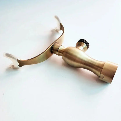 Brass-finished hand shower holder bracket with curved spout and dual handles for wall mount bathroom accessories
