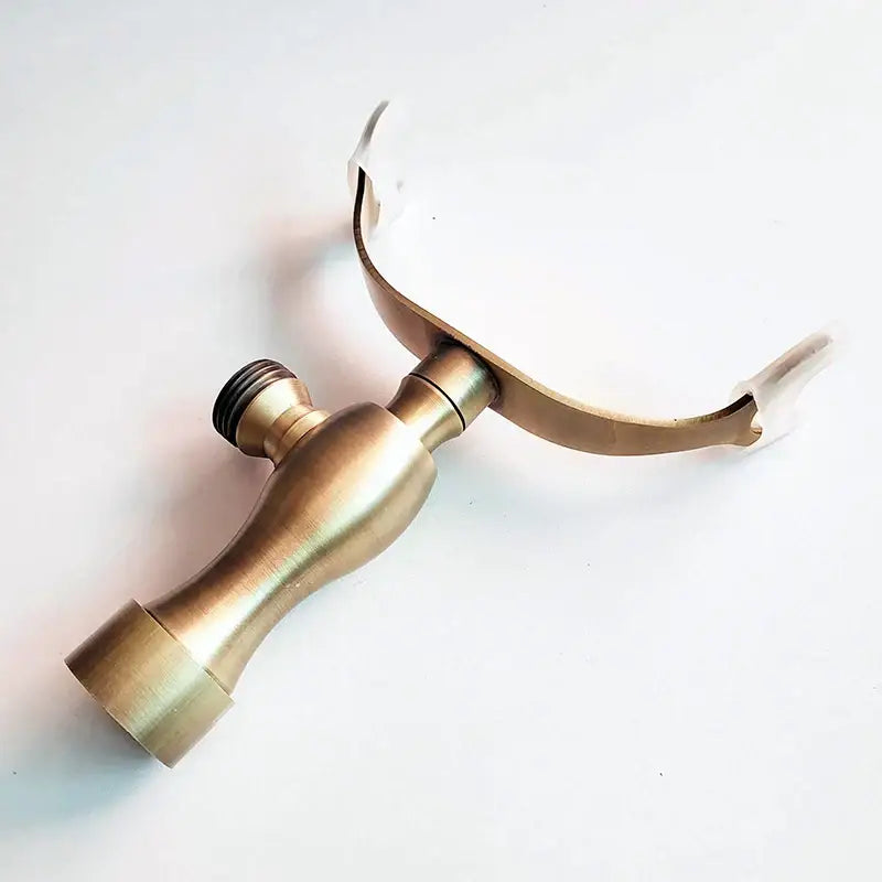 DecorBites antique brass hand shower holder bracket with curved dual-armed design and threaded connection for wall mount