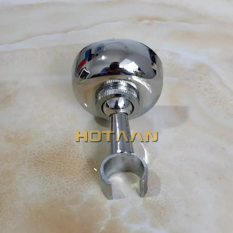Decorbites™ shiny chrome spherical hand shower holder with curved mounting bracket and threaded base pedestal hook