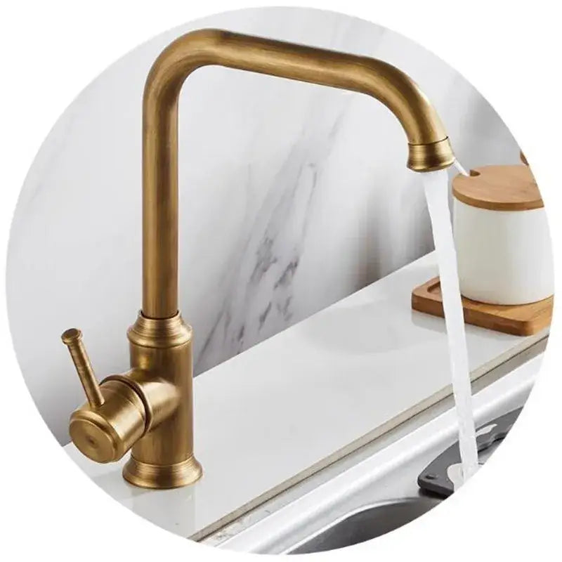 Decorbites antique brass kitchen faucet with 360° swivel, sleek curved spout, and single lever brass kitchen faucet handle